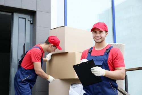 Local office removals team handling desks and equipment for a Mile End business move