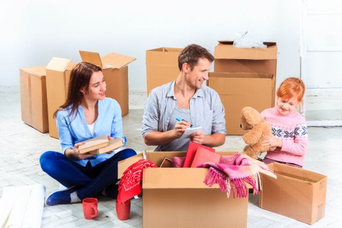 Professional movers handling flat removals in Mile End apartment building
