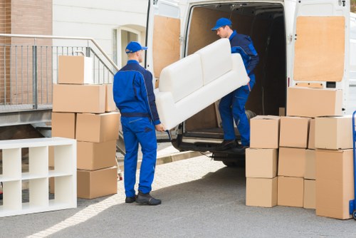 Professional movers handling access challenges in an East London street