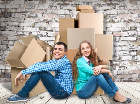 Packed moving boxes and furniture ready for a Mile End house removal