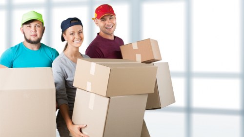 Prepared moving boxes and household items ready for collection in Mile End