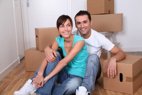 Packed boxes and furniture prepared for a local Mile End house move