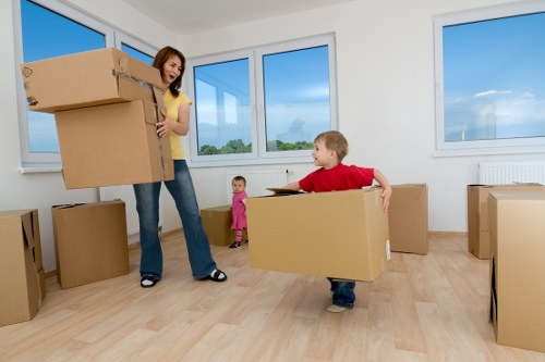 Packed office equipment ready for a business move in Mile End