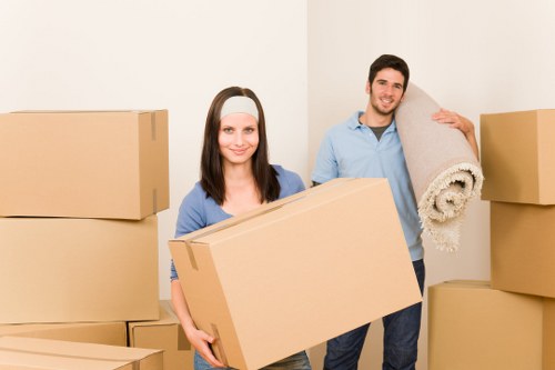 Professional furniture removal team handling heavy items in Mile End