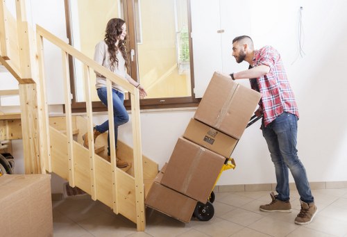 Careful loading of office furniture and IT items during a Mile End relocation