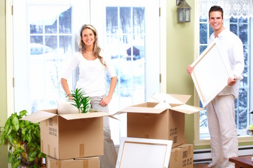Team handling household items for a move near Mile End
